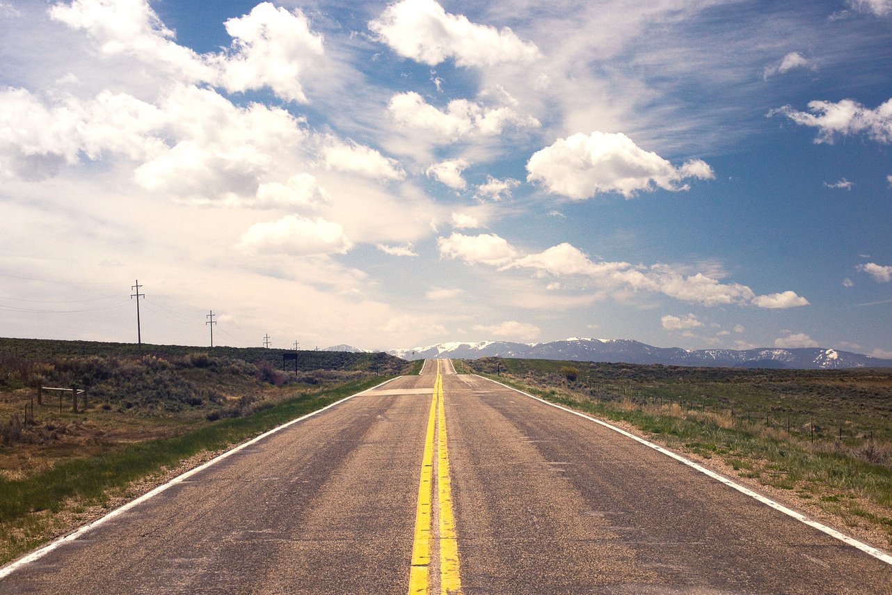 Clear Highway with Clouds on the Background